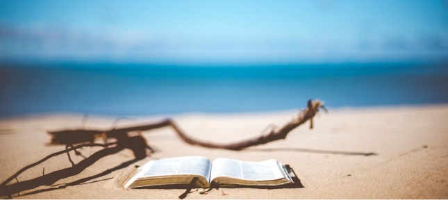 Bible on sand at the beach