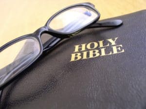 Glasses on holy Bible